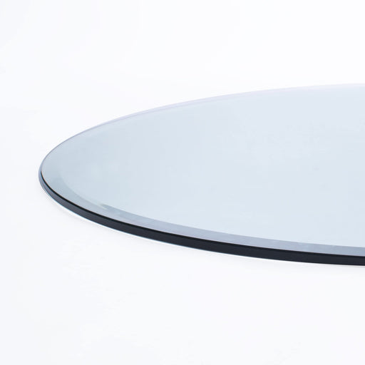 Round glass table top on a white background